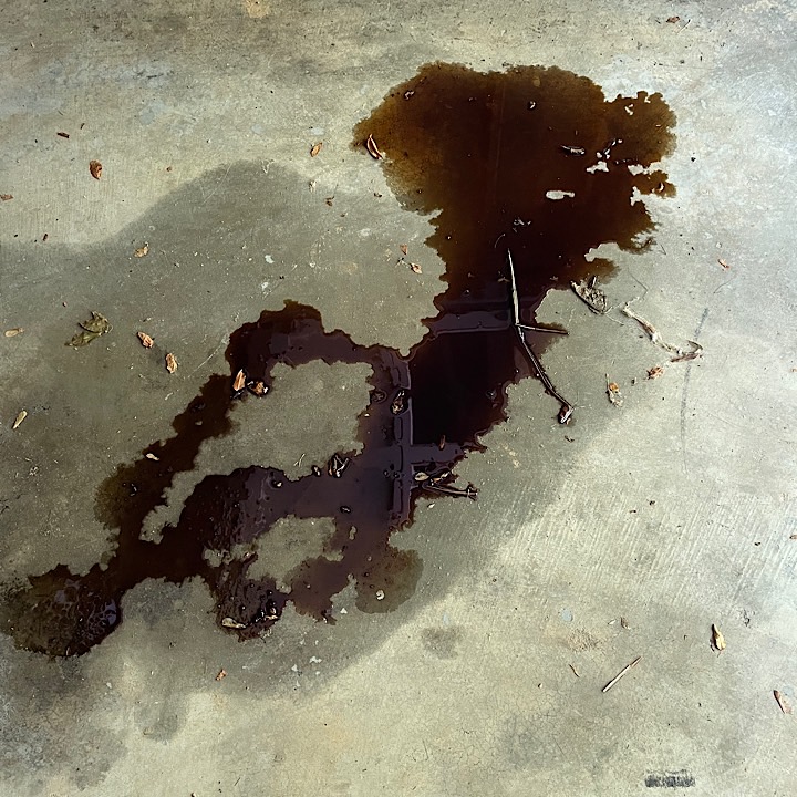Oil puddle on concrete floor