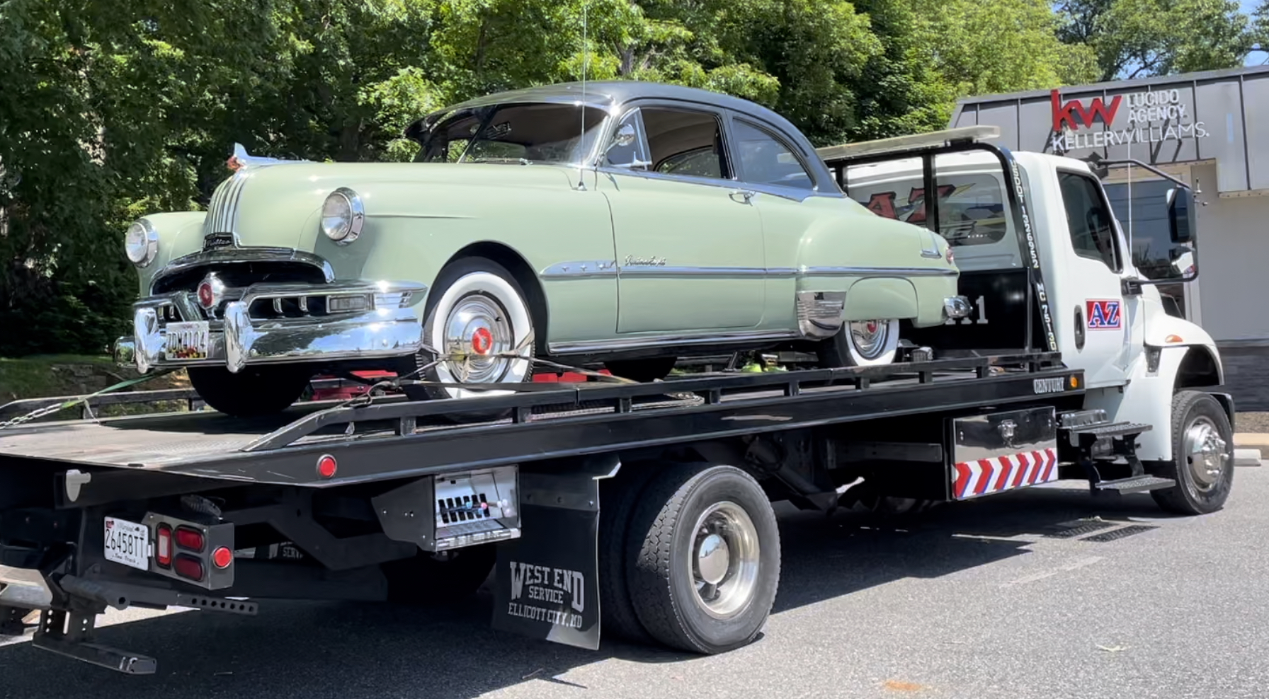 1951 Pontiac loaded on tow truck